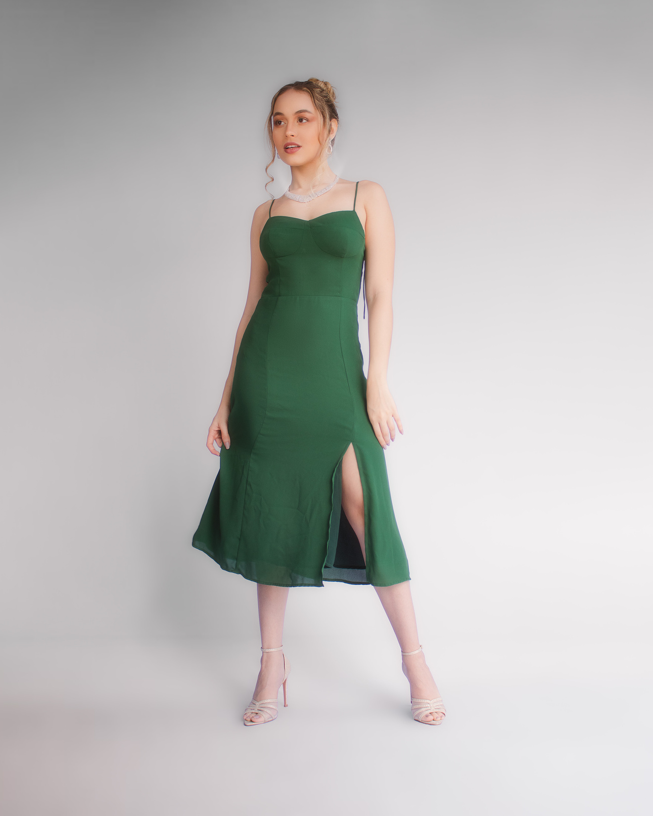 Model Wearing a Green Dress Looking Away
